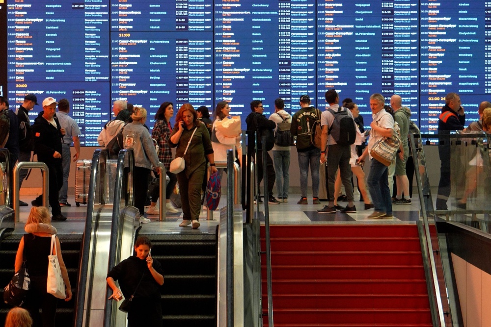 Headlines Reveal Why CFAR Travel Insurance is Essential Now People stuck at a foreign airport